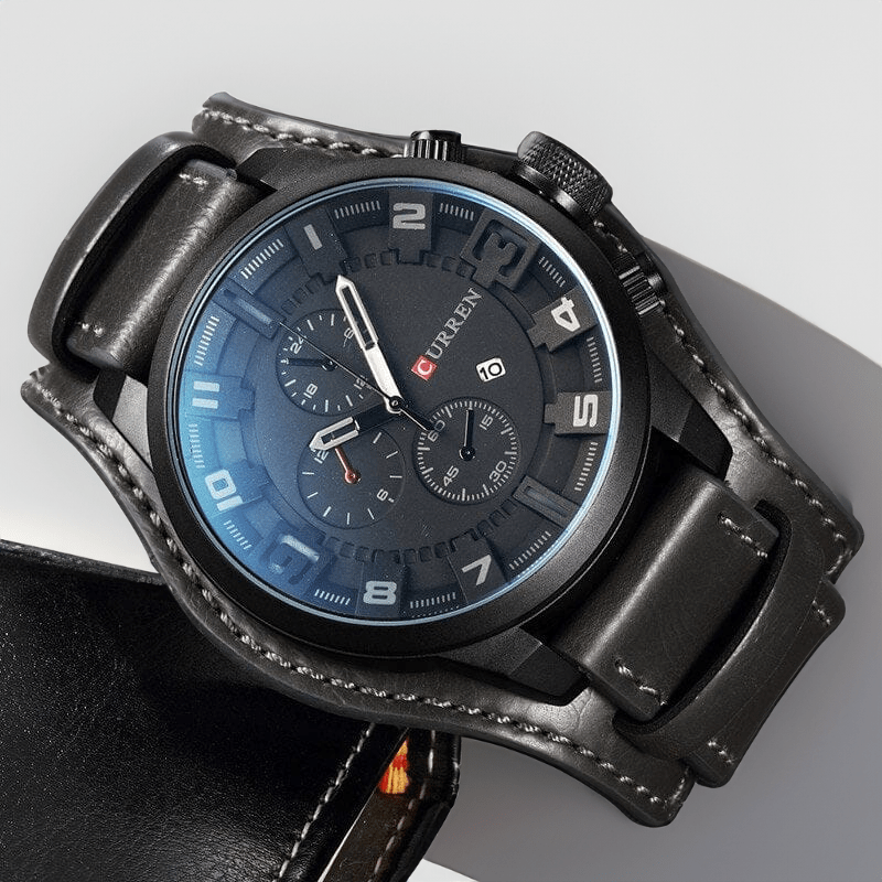 Montre en cuir chronographe noire posée