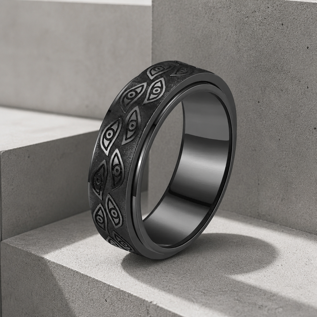 Bague tournante homme noir mat, motif d'yeux gravé en relief