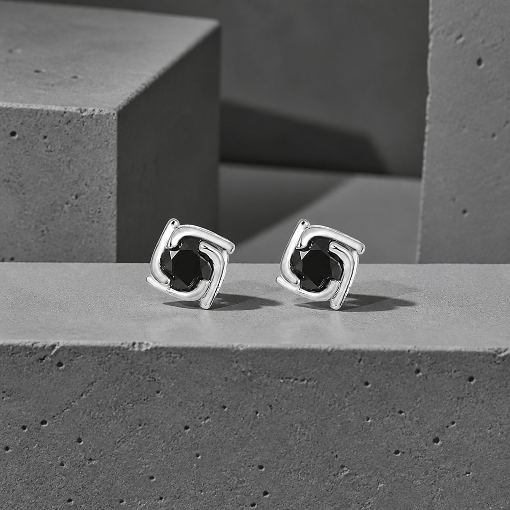 Boucles d'oreilles homme diamant noir en argent 925, la paire sur béton
