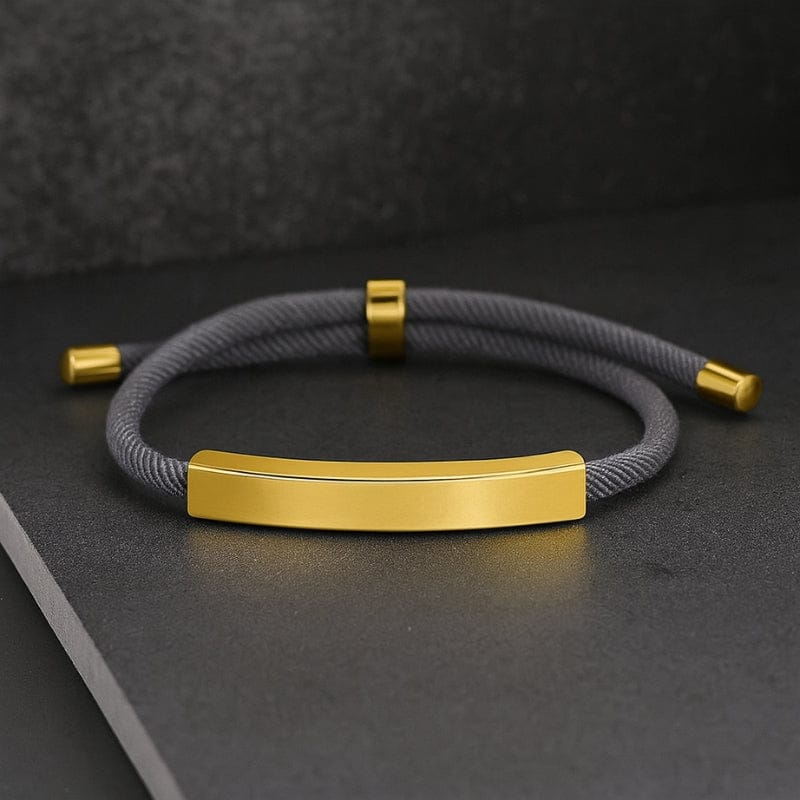 Bracelet cordon personnalisé gris avec plaque dorée gravable