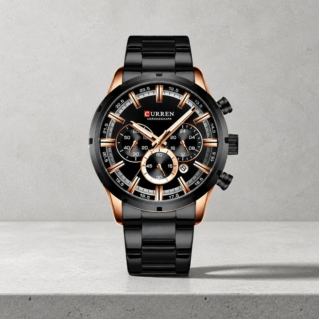 Grosse montre homme ronde chronographe noire et or rose sur dalle de béton