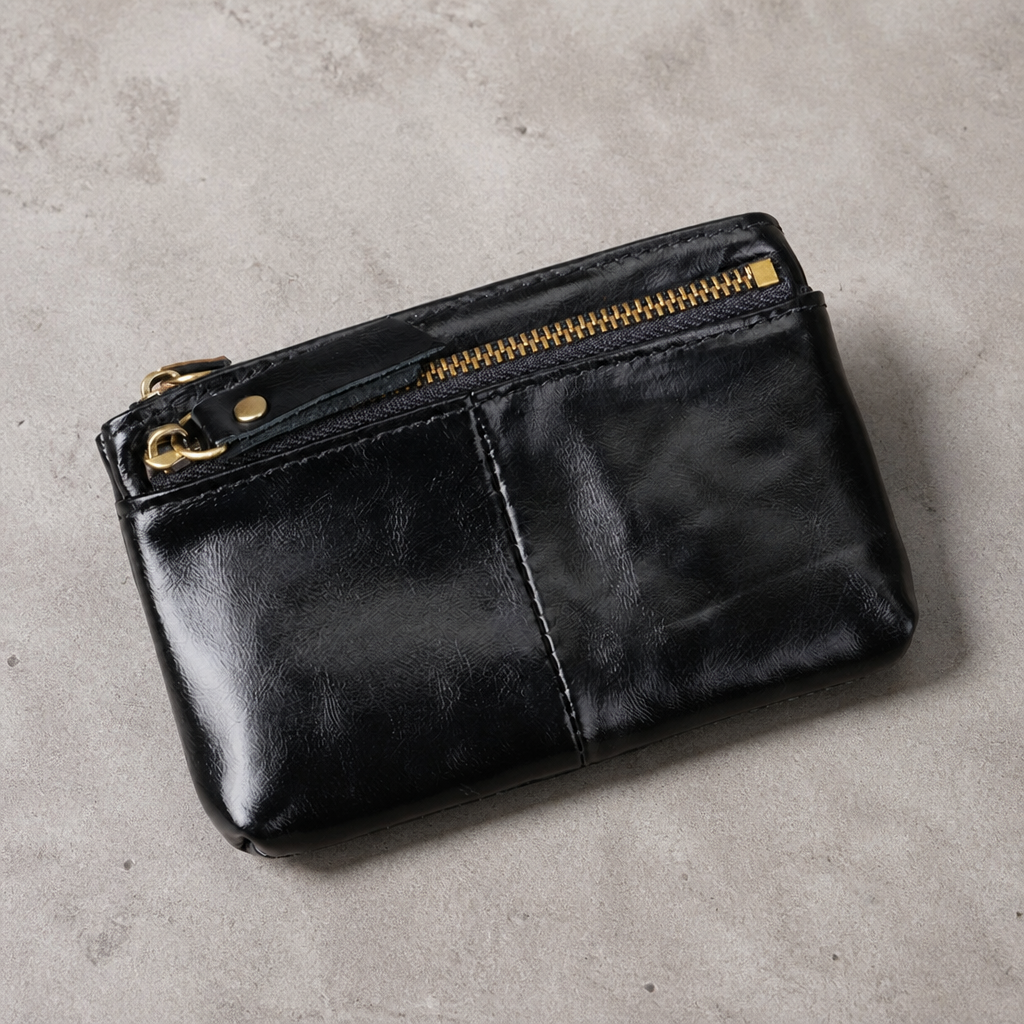 Porte-monnaie long homme en cuir noir, deux zips et anneau porte-clés, vue de face