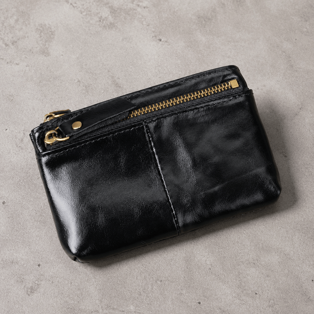 Porte-monnaie long homme en cuir noir, deux zips et anneau porte-clés, vue de face