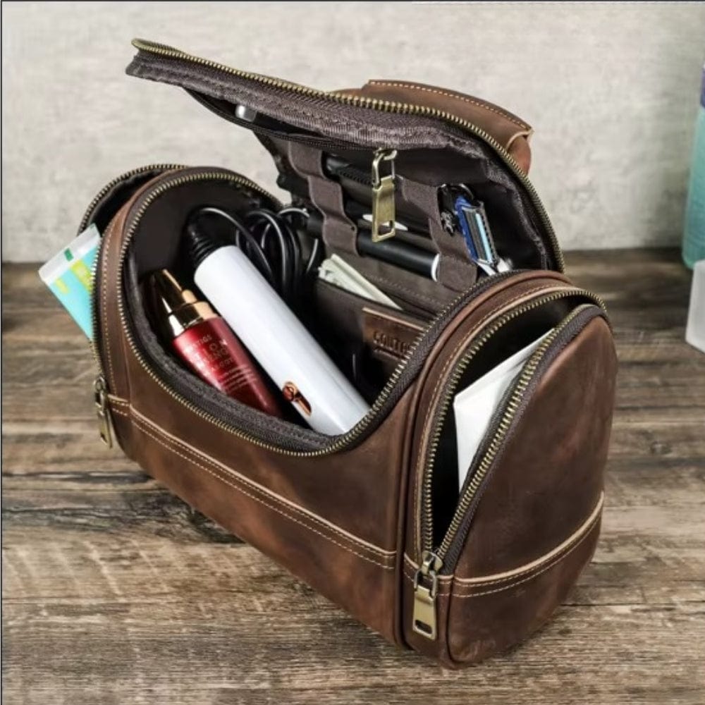 Trousse de toilette homme cuir vintage ouverte montrant compartiments organisés et élastiques maintien