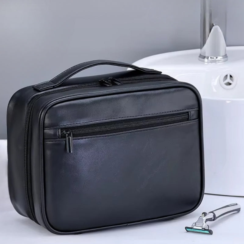 trousse de toilette homme noire en cuir avec poignée renforcée