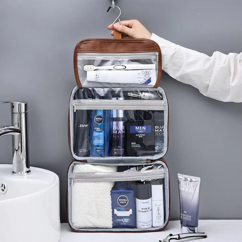 trousse de toilette homme suspendue ouverte avec crochet et compartiments transparents