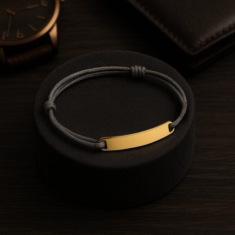 Cordon bracelet homme gris avec barrette dorée à graver
