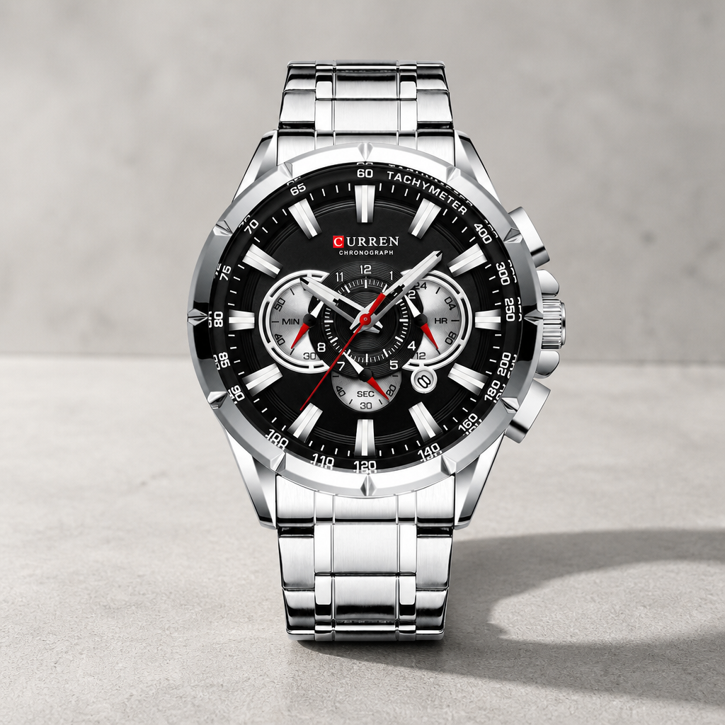 Montre bracelet acier homme chronographe acier et cadran noir sur dalle de béton