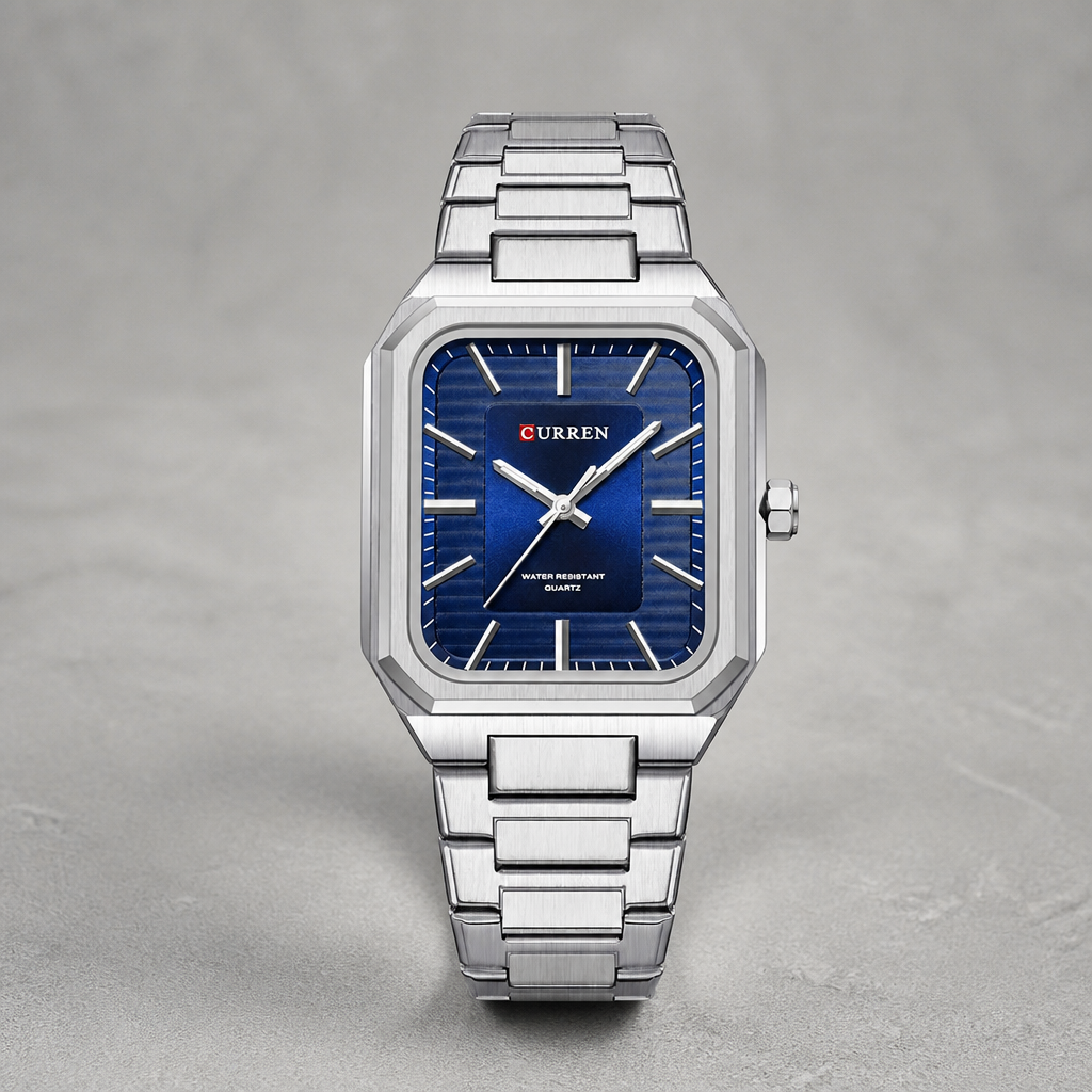Montre cadran carré homme à cadran bleu et boîtier acier sur béton clair