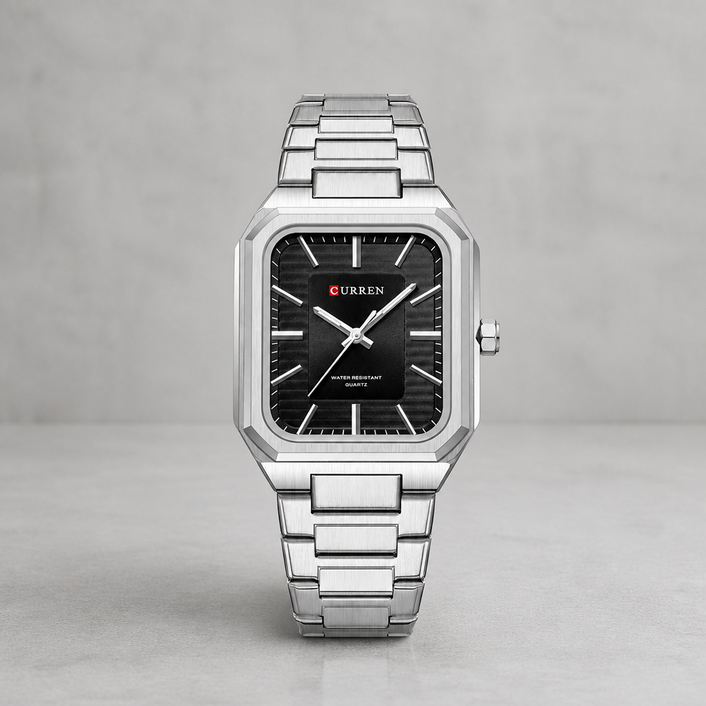 Montre cadran carré homme à cadran noir et boîtier acier sur béton clair