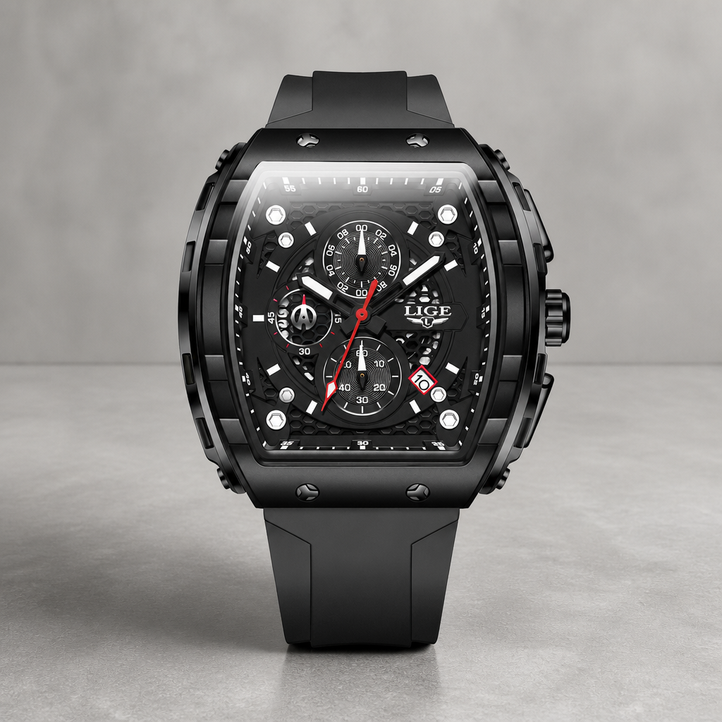 Montre cadran tonneau chronographe noire posée sur du béton gris clair