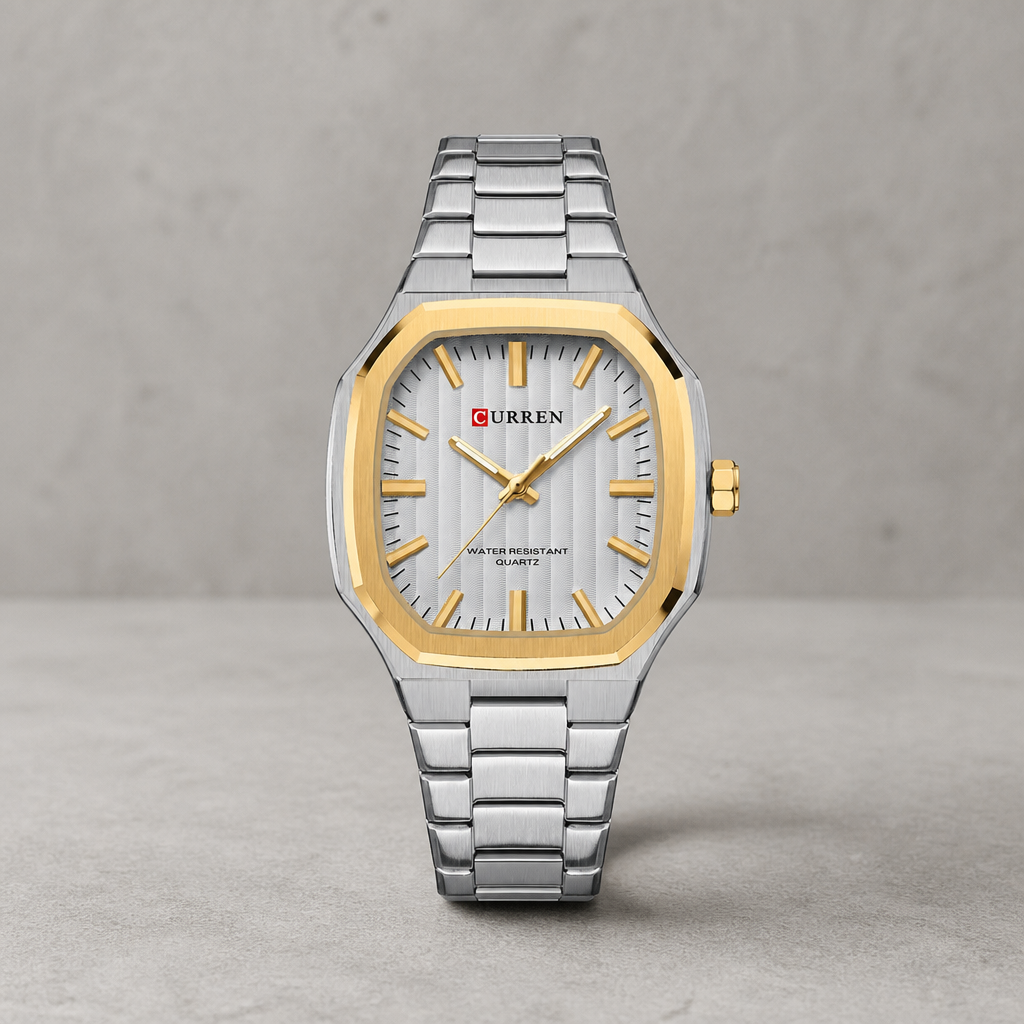 Montre classique homme carrée à cadran blanc et lunette dorée, bracelet acier, sur béton