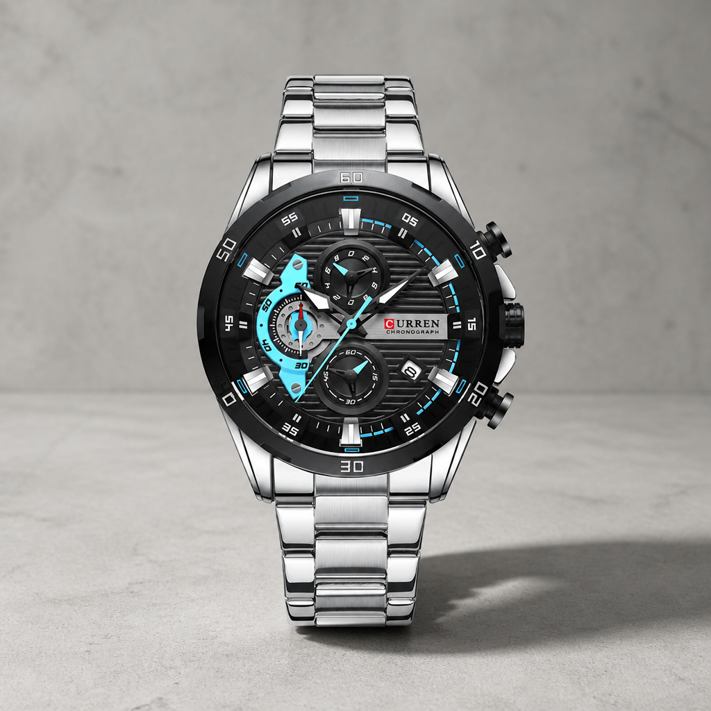 Montre homme chronographe acier argent à accents bleus sur dalle de béton