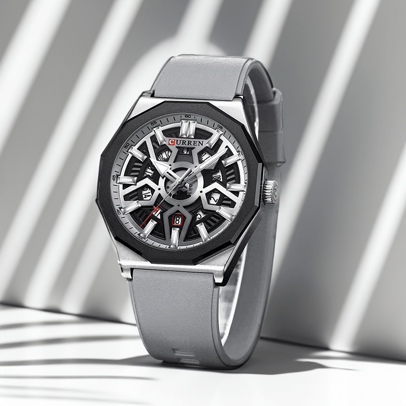 Montre homme sportive grise, boîtier acier et bracelet silicone à cadran ajouré