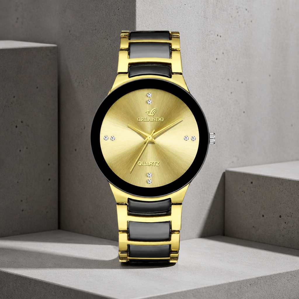 Montre noir et or homme à quartz, cadran doré, sur béton