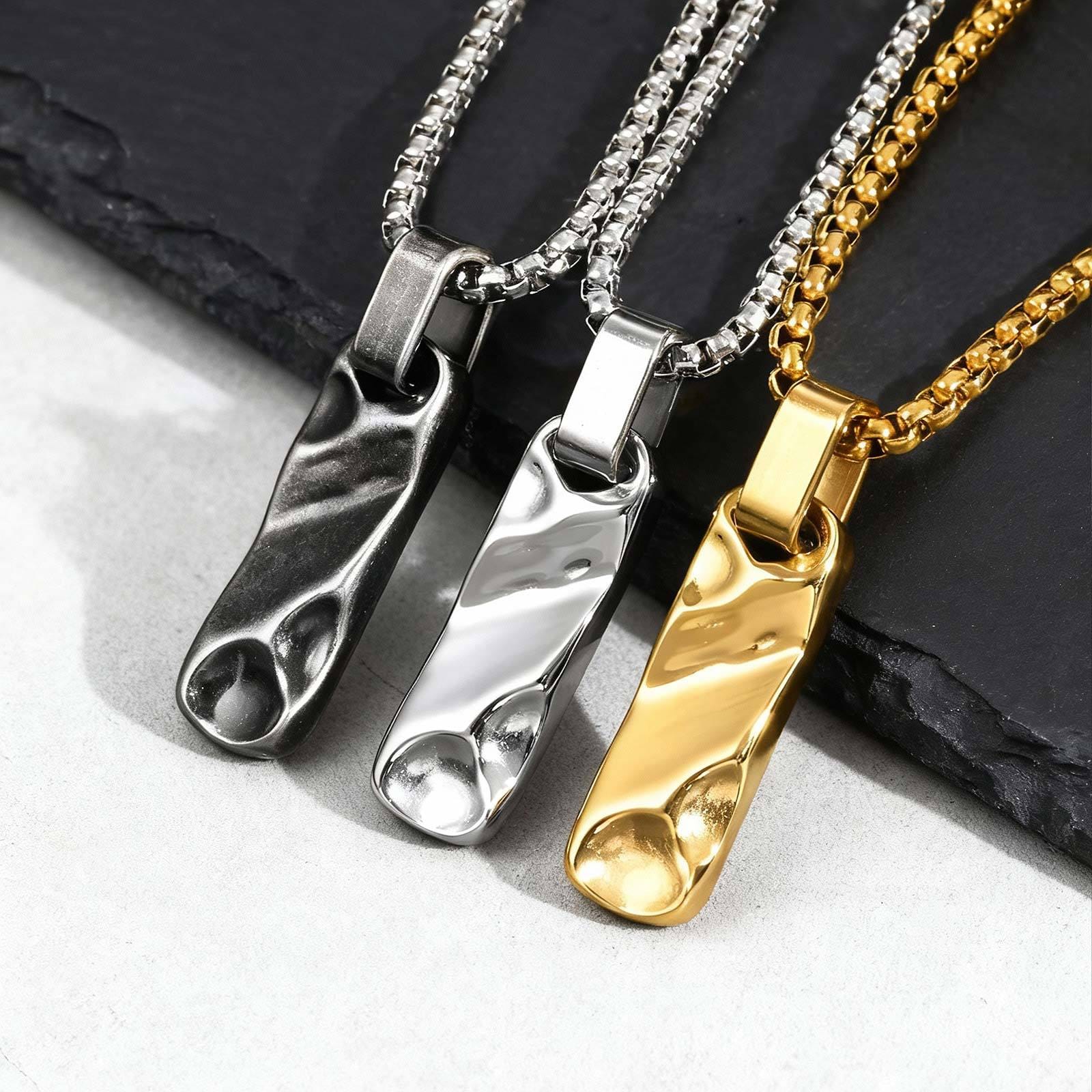 pendentifs originaux pour homme en trois couleurs noir or et argent