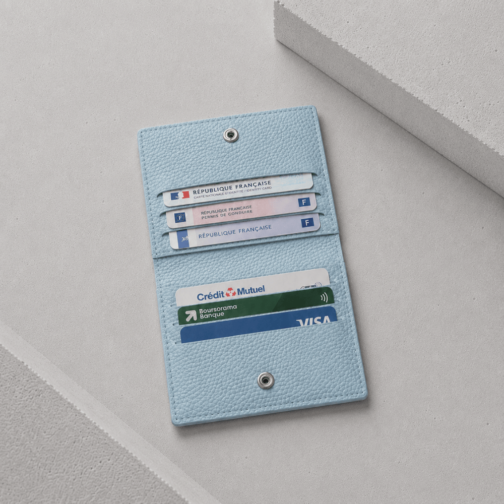 Porte-cartes cuir bleu ouvert, six logements pour cartes 